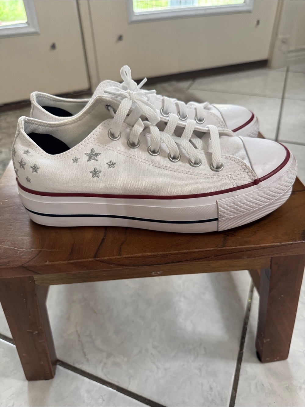 Converse White Low-Top Sneakers with Silver Star Details and Red Stripe